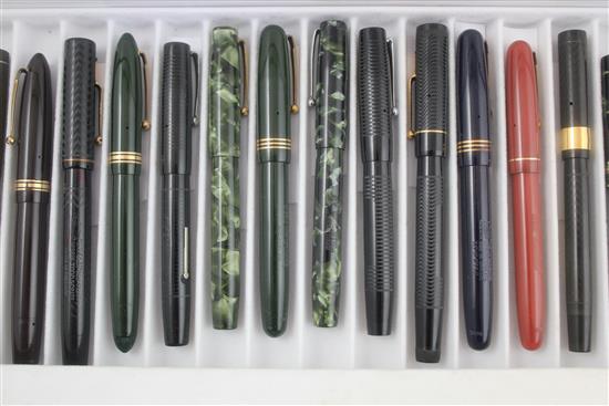 A collection of twenty Mabie Todd Swan fountain pens and a similar ejector pencil,